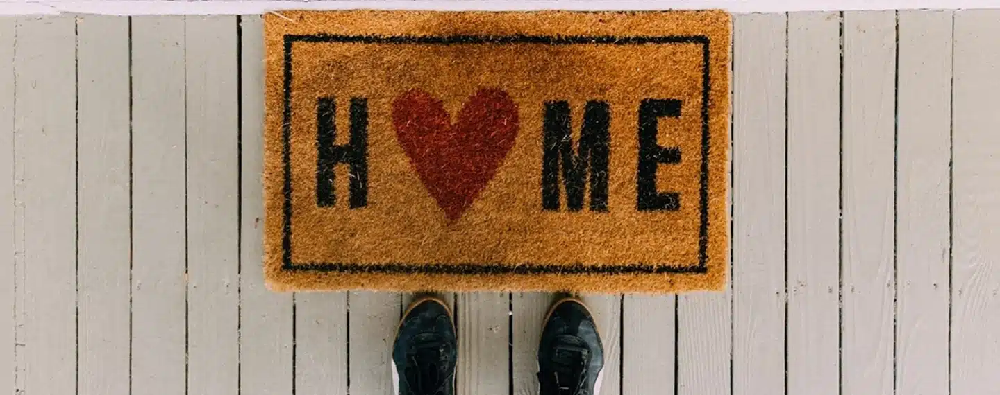 Doormat with Home written on it and a heart instead of the letter o in Home.